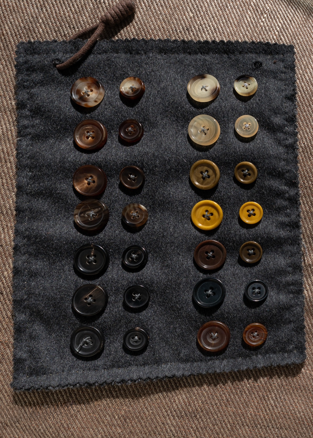 Buffalo horn and corozo, from near black through tobacco to olive and gold.