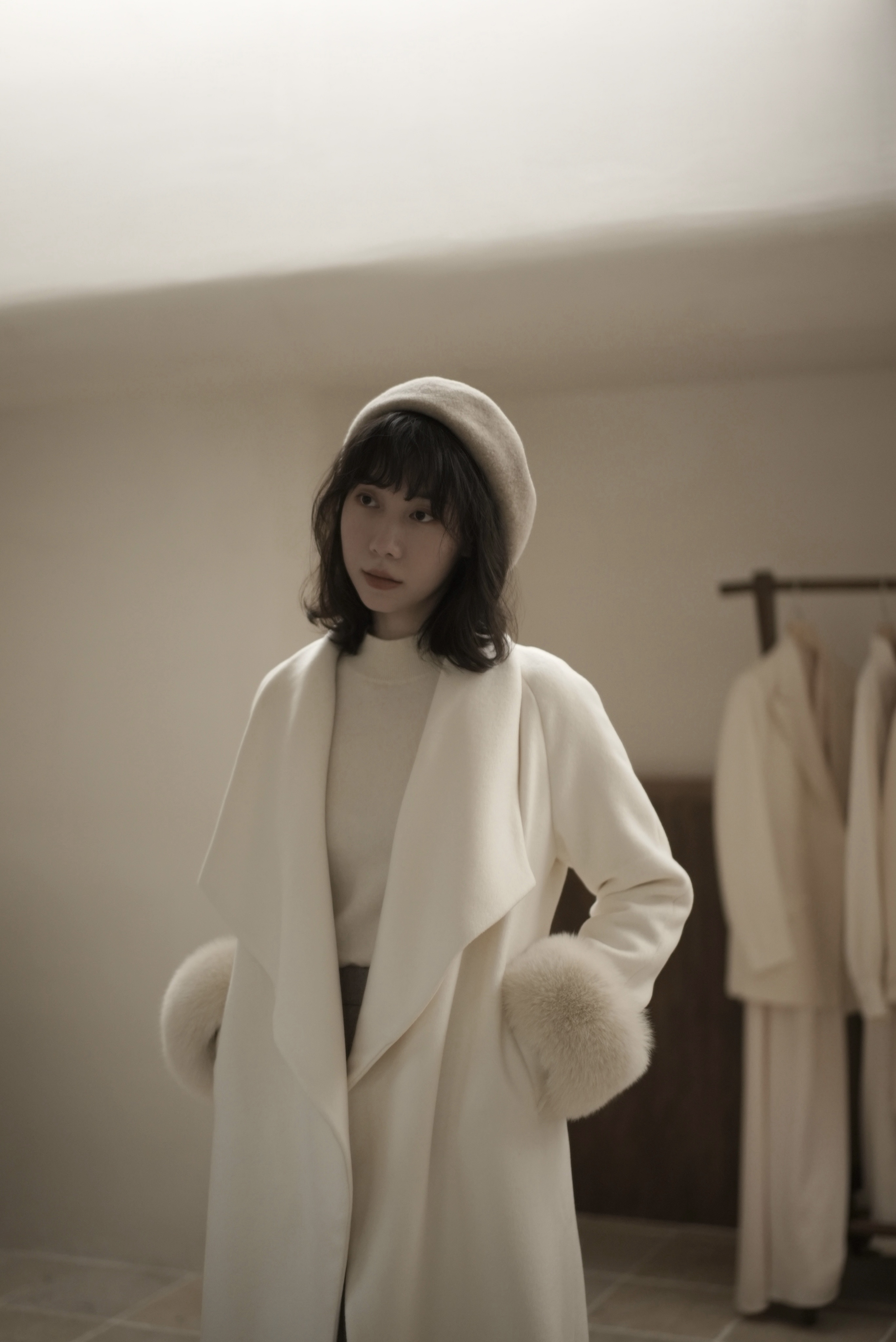 Snow White Cashmere Coat — Front, Hand in Pocket